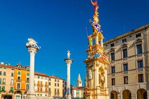 Columns with winged lion and statues in Piazza dei Signori square photo