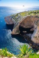 Blue grotto arch on Malta island and Filfla, Mediterranean sea