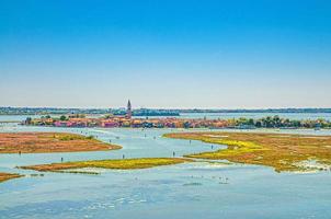 Aerial panoramic view of Venetian Lagoon with Burano island, water canals and swamp photo