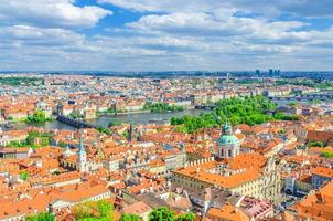 Top aerial panoramic view of Prague historical city centre with red tiled roof buildings in Mala Strana photo