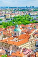 Top aerial vertical view of Prague historical city centre with red tiled roof buildings in Mala Strana photo