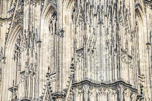 Close-up view of Cologne Cathedral Catholic Church gothic style building wall facade photo