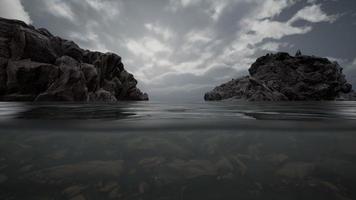 Half underwater in northern sea with rocks video