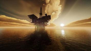 Offshore Jack Up Rig in The Middle of The Sea at Sunset Time video