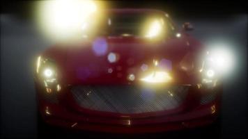 auto sportiva di lusso in studio scuro con luci intense video