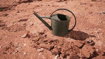 Beverage can in sand and rocks desert video