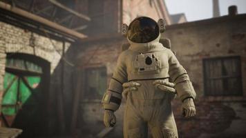 Lost Astronaut near Abandoned Industrial Buildings of Old Factory video