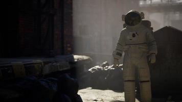 Lost Astronaut near Abandoned Industrial Buildings of Old Factory video