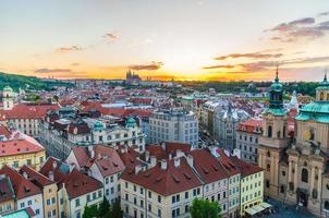 Top aerial panoramic view of Prague Old Town historical city centre with red tiled roof buildings