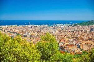 Aerial panoramic view of Barcelona city historical quarters districts with Mediterranean Sea photo