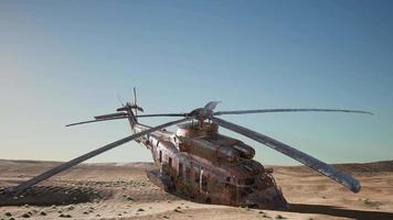 old rusted military helicopter in the desert at sunset video