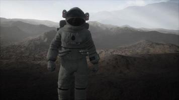 Spaceman walks on the red planet Mars. Space Mission video