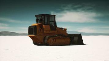road grading machine on the salt desert road video
