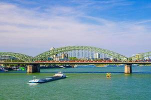 The Hohenzollern Bridge or Hohenzollernbrucke across Rhine river photo