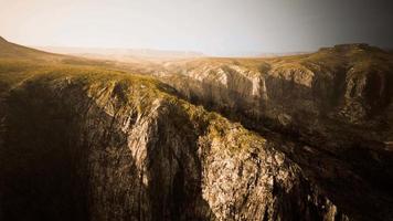 dry yellow grass on the rocky mountain with heavy fog video