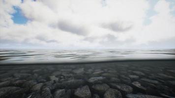 ocean seascape with sky and ocean wave splitted by waterline to underwater part video