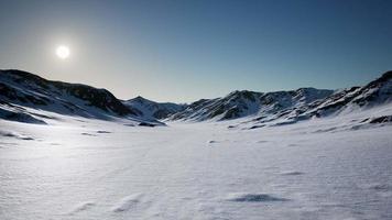 Aerial Landscape of snowy mountains and icy shores in Antarctica video