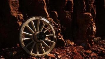 old wooden cart wheel on stone rocks video