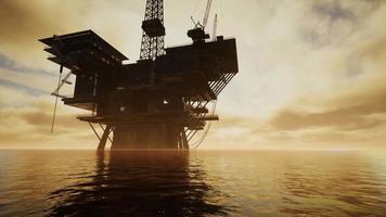 Offshore Jack Up Rig in The Middle of The Sea at Sunset Time video