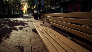 Park bench in downtown on a cloudy afternoon video