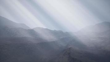 Sun Rays against the Backdrop of the Mountains video