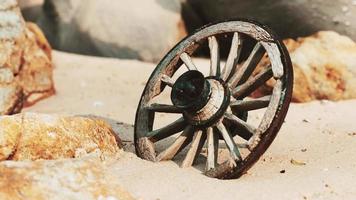 old tradition waggon wheel on the sand video