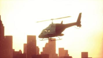 Silhouette helicopter at city scape background video