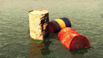 old rusty barrels oil in sea water illustrates the pollution of environment video