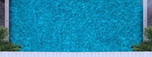 Aerial view images of swimming pool in a sunny day. photo