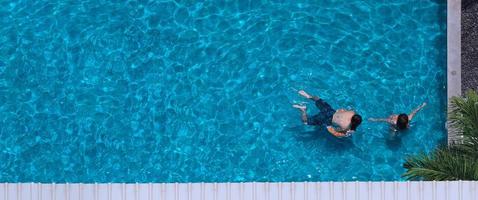 Aerial view images of swimming pool in a sunny day. photo