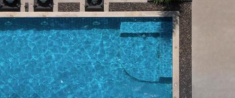 Aerial view images of swimming pool in a sunny day. photo