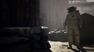 Lost Astronaut near Abandoned Industrial Buildings of Old Factory video