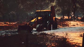 excavator tractor in bush forest video