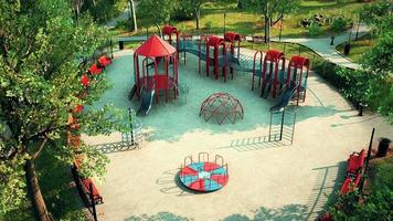 empty children playground for leisure in the park closed in a while Coronavirus video