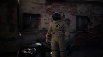 Lost Astronaut near Abandoned Industrial Buildings of Old Factory video