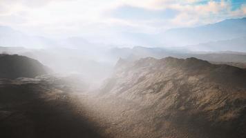 aerial vulcanic desert landscape with rays of light video