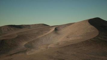 Aerial view on big sand dunes in Sahara desert at sunrise