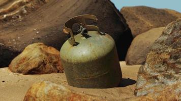 old cooking gas cylinder on sand beach video