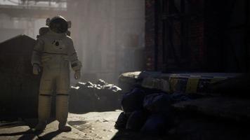 Lost Astronaut near Abandoned Industrial Buildings of Old Factory video