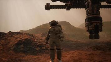 Spaceman walks on the red planet Mars. Space Mission video