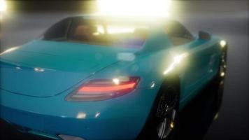 luxury sport car in dark studio with bright lights video