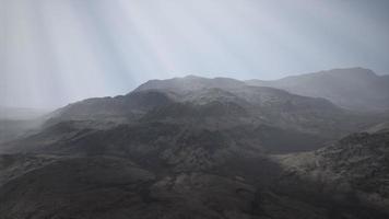 Sun Rays against the Backdrop of the Mountains video