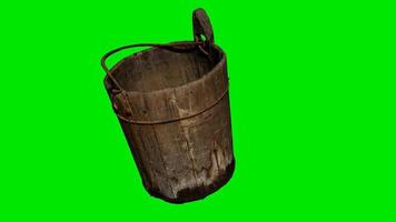 Old traditional wood bucket at green chromakey background video