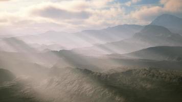 aerial vulcanic desert landscape with rays of light video