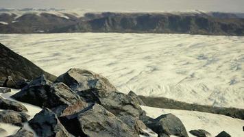 Snowy mountains and dark rocks video