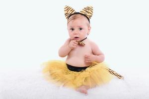 funny baby girl dressed up in carnival photo