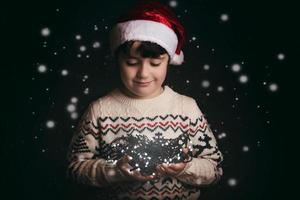 little boy holding an old flashlight photo