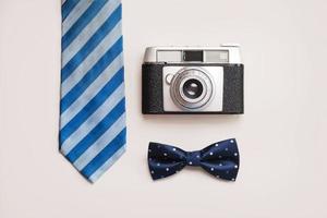 Happy Father's Day.Tie, bow tie and retro photo camera