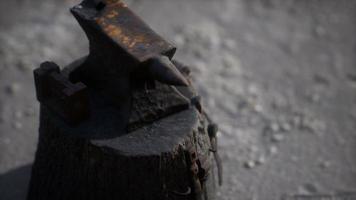 Old anvil attached to a stump video