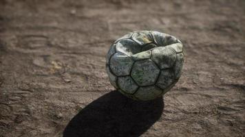 Old soccer ball the cement floor video